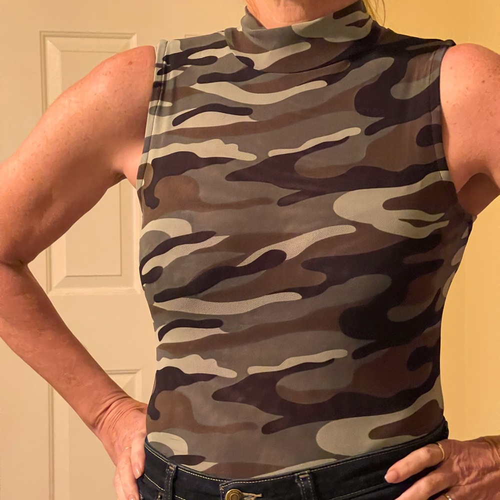 Great body suit- never worn- camouflage pattern. Stretch fabric. Size L